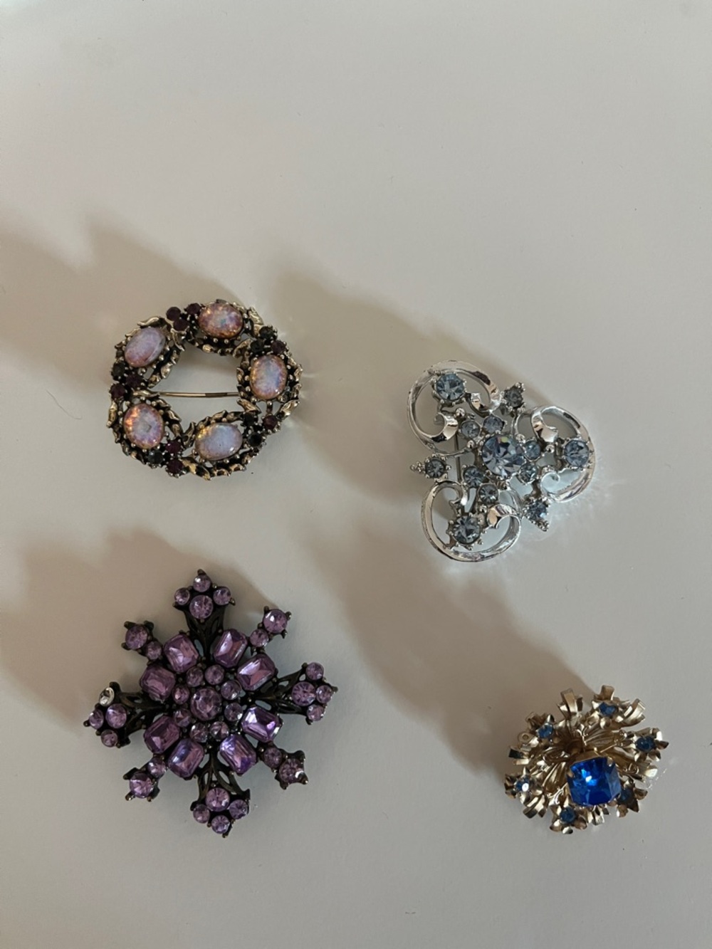 Brooches 4 you get all four. Put on a coat, sweater, blouse, purse.